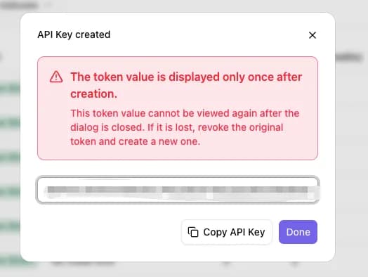 "API Key created" dialog with a red warning reading "The token value is displayed only once after creation", a masked token field, and Copy API Key and Done buttons at the bottom